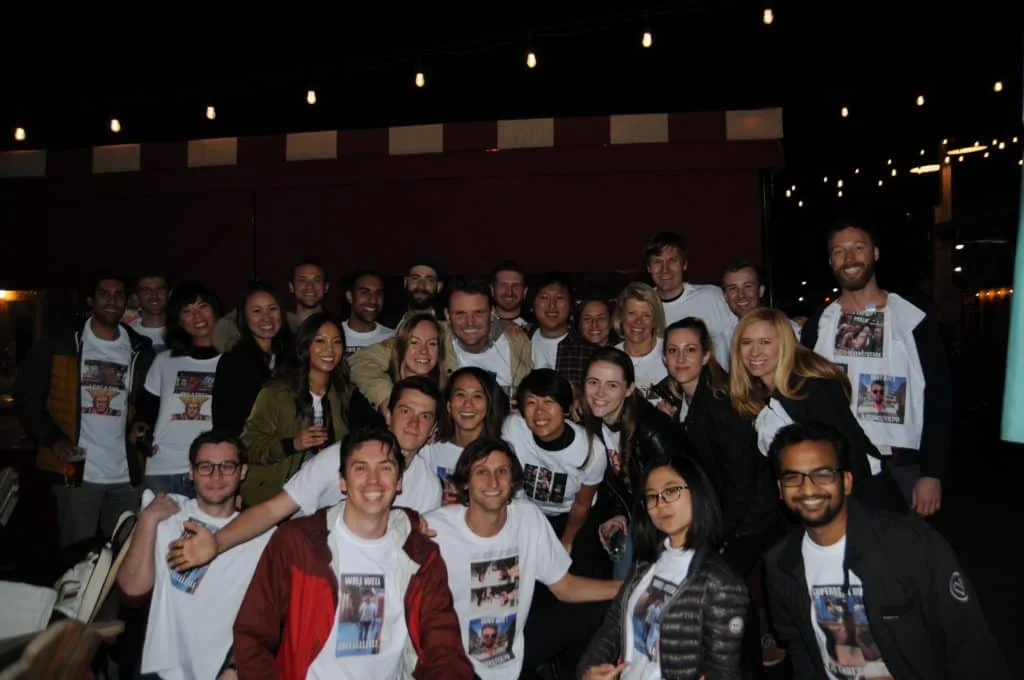 Airbnb coworkers wearing custom shirts for Tommy's farewell